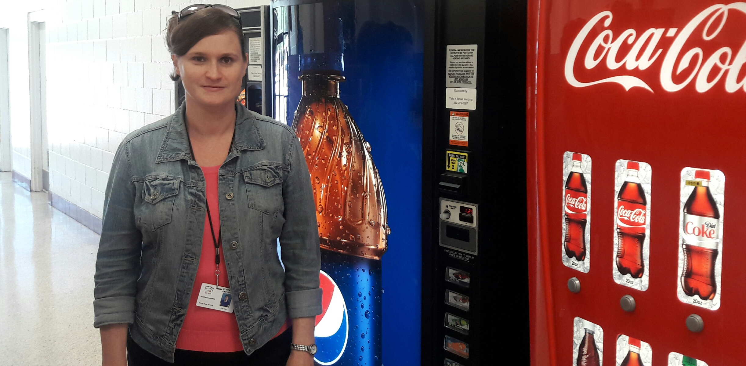 BBE vendor standing beside drink machines